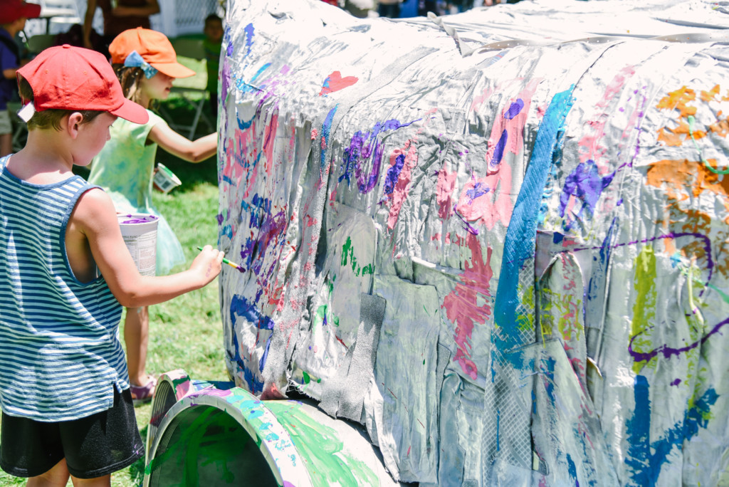 Shoreline festival with 100+ children — art from waste